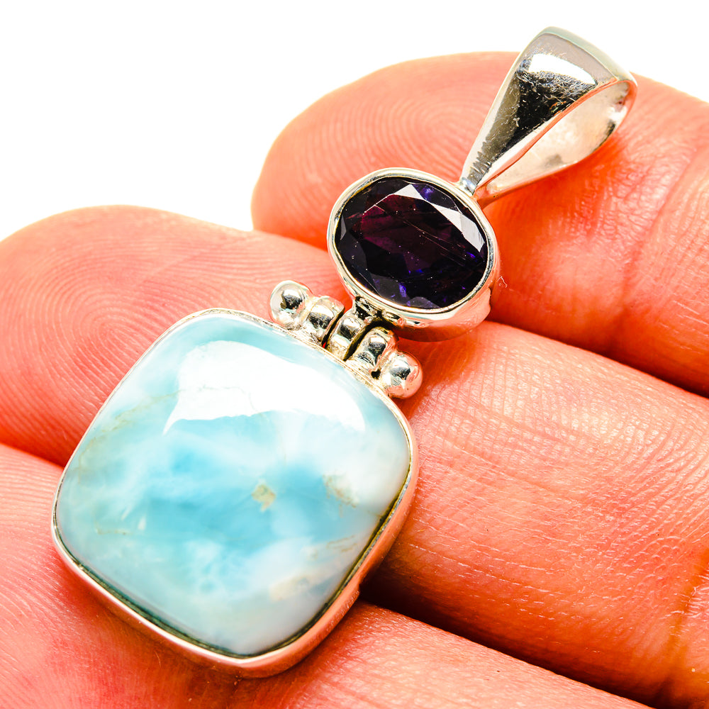 Sterling silver pendant with oval Larimar and purple Tanzanite, hinged top bail.