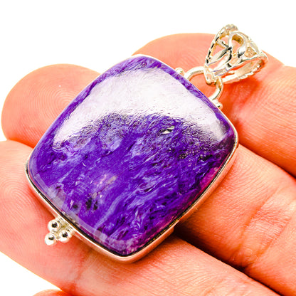Charoite pendant in 925 sterling silver with purple marbled stone cabochon and clasp bail