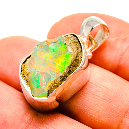 Rough Ethiopian opal pendant, 925 sterling silver bezel, iridescent green-orange face