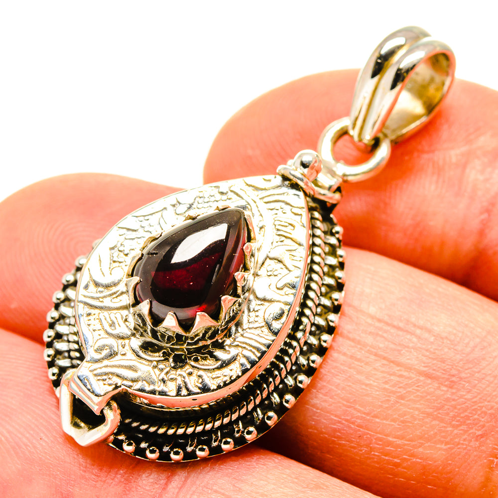 Sterling silver poison garnet pendant with dark red teardrop gemstone bail