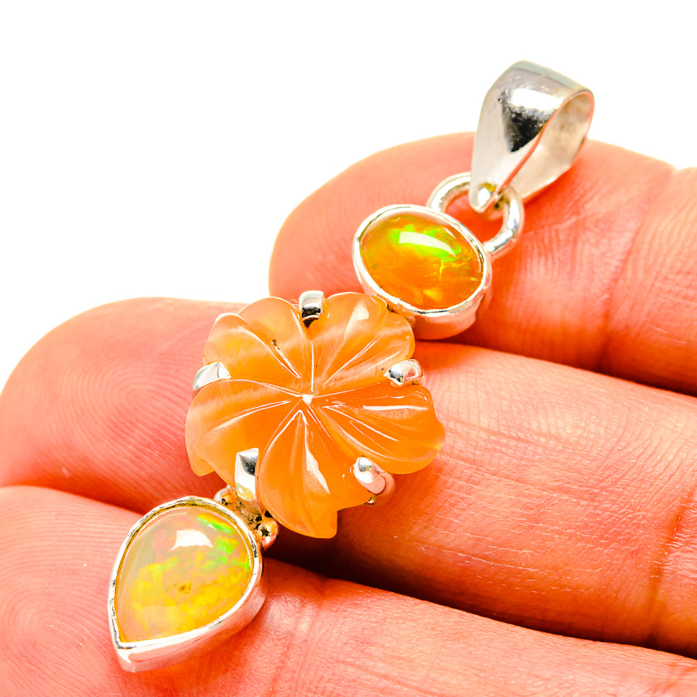 Sterling silver pendant with orange flower charm and round yellow opal accents