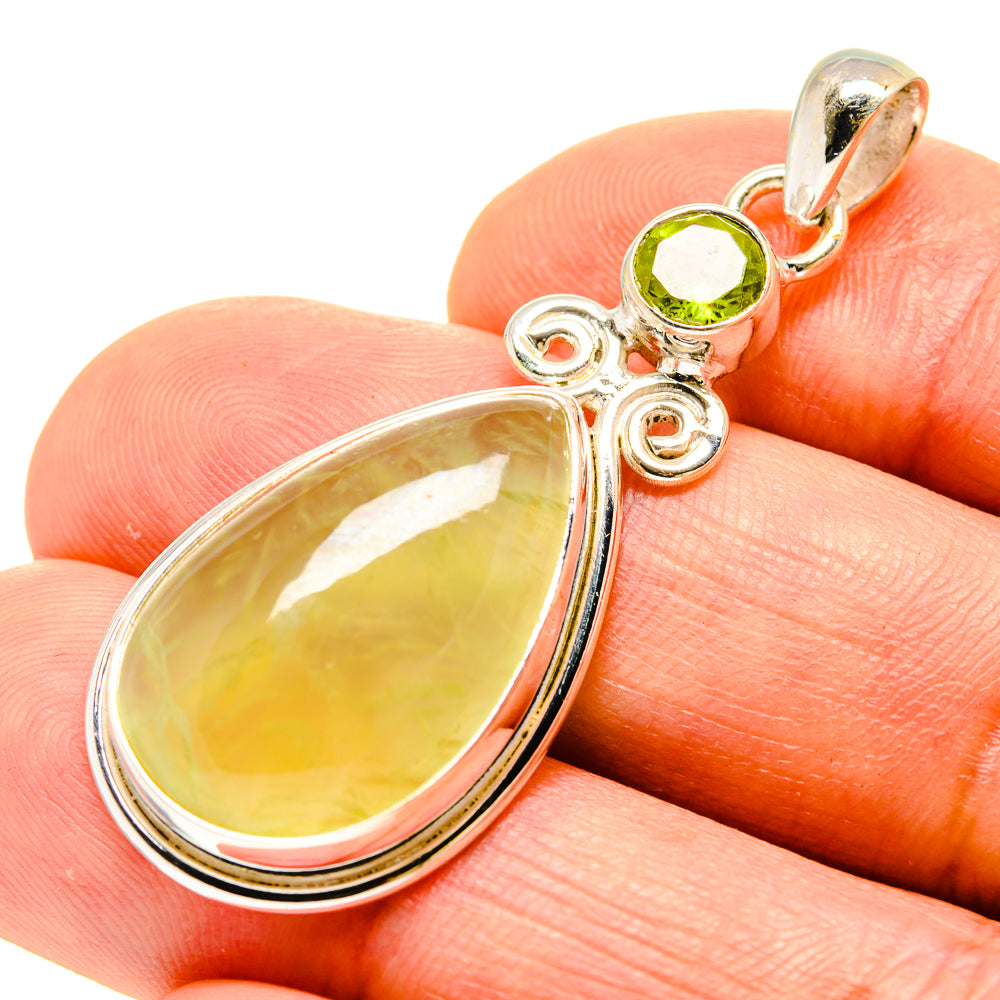 Sterling silver pendant with yellow-green teardrop stone and small round peridot top