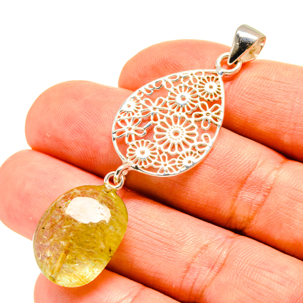 Sterling silver citrine pendant with filigree heart and oval yellow gemstone drop