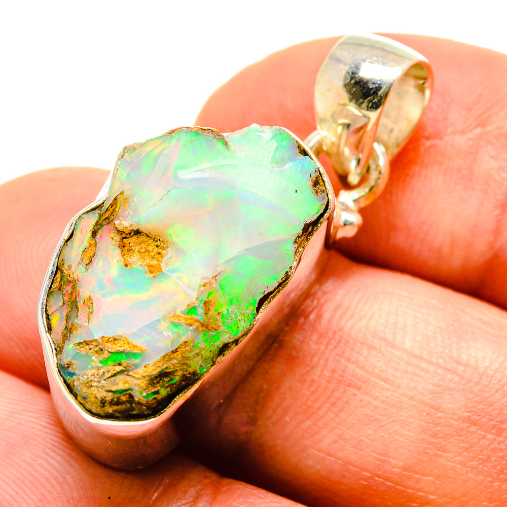 Rough opal pendant, sterling silver bezel, green iridescent stone with bail