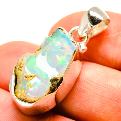 Rough opal pendant in 925 sterling silver with iridescent white-green stone bezel
