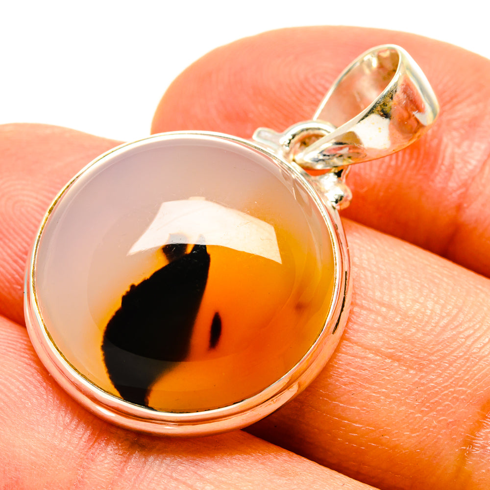 Round amber agate cabochon sterling silver pendant with black pattern bezel