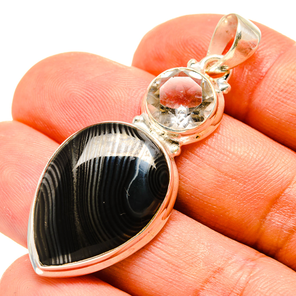 Sterling silver pendant: teardrop black striped stone with clear quartz cabochon