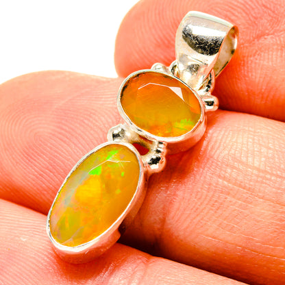 Sterling silver opal pendant with round and oval yellow-orange stones, faceted