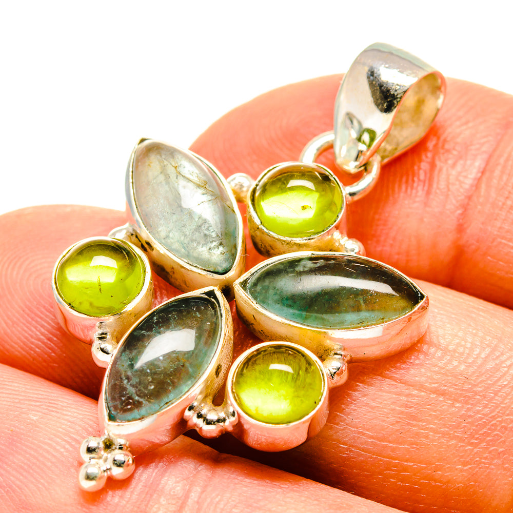 Sterling silver green gemstone pendant with oval and round stones, flower cluster.