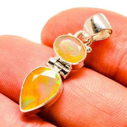 Opal pendant close-up with two faceted teardrop stones on sterling silver bail