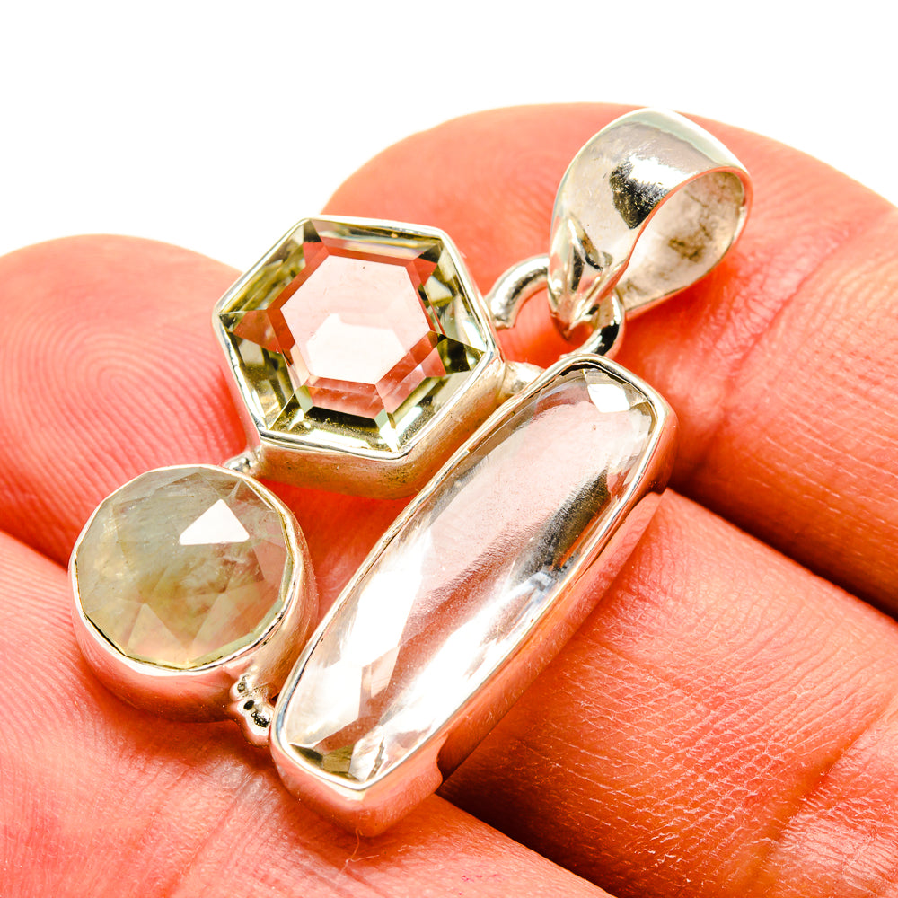 Sterling silver gemstone pendant with clear rectangular stones and light green rounds