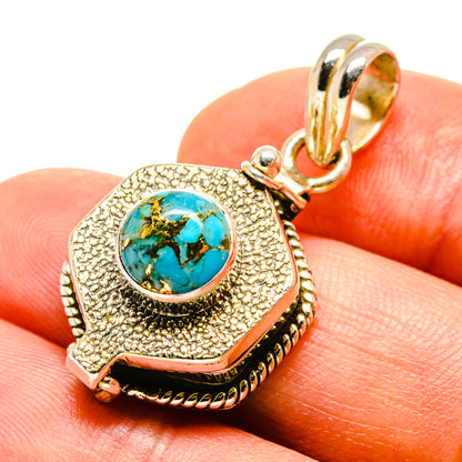 Turquoise poison pendant charm with textured gold-tone bezel and ornate bail