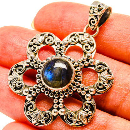 Labradorite pendant in ornate 925 sterling silver with dark blue oval stone