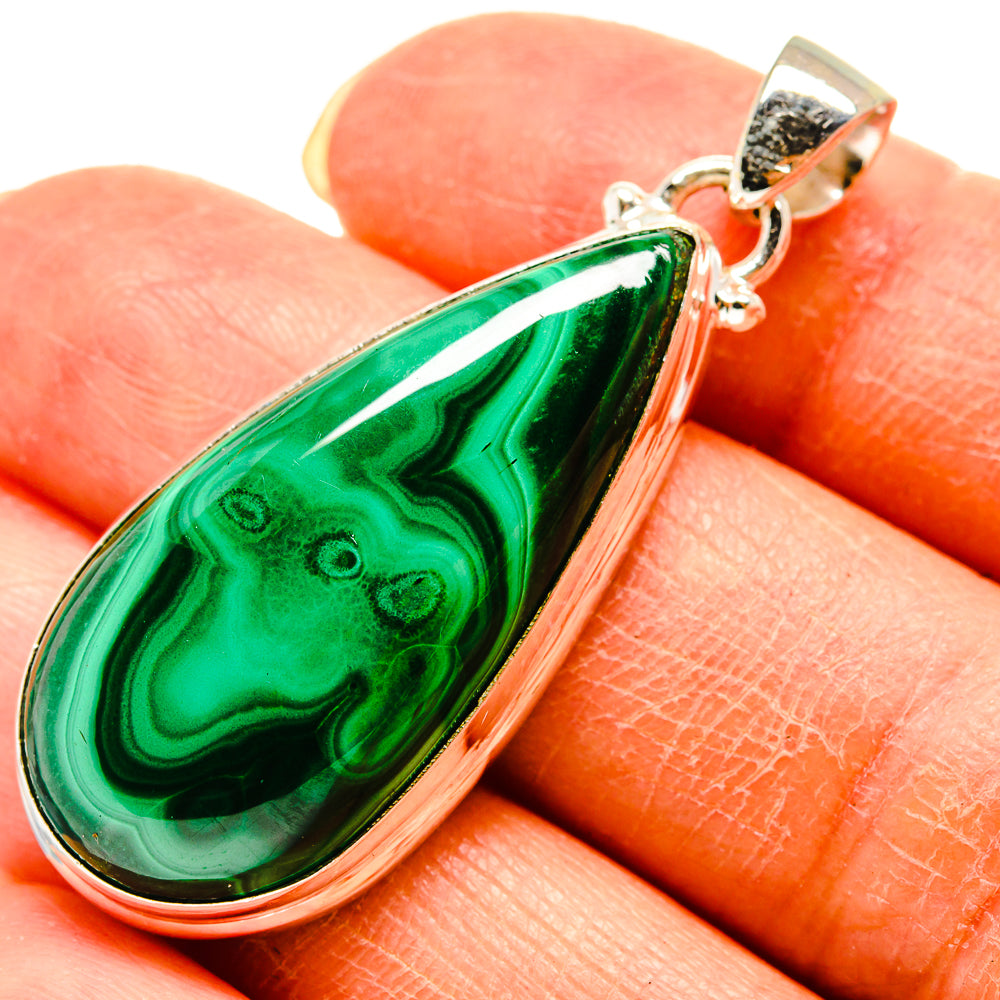 Malachite and chrysocolla teardrop pendant in silver bezel, green with dark veins