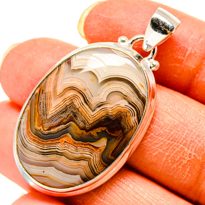Lace agate pendant with oval silver bezel and multicolor banded stone