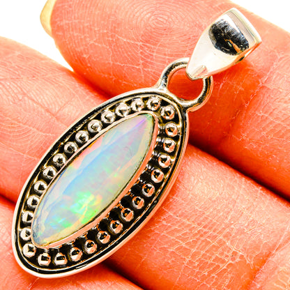 Ethiopian opal pendant, 925 sterling silver bezel with faceted teardrop cabochon