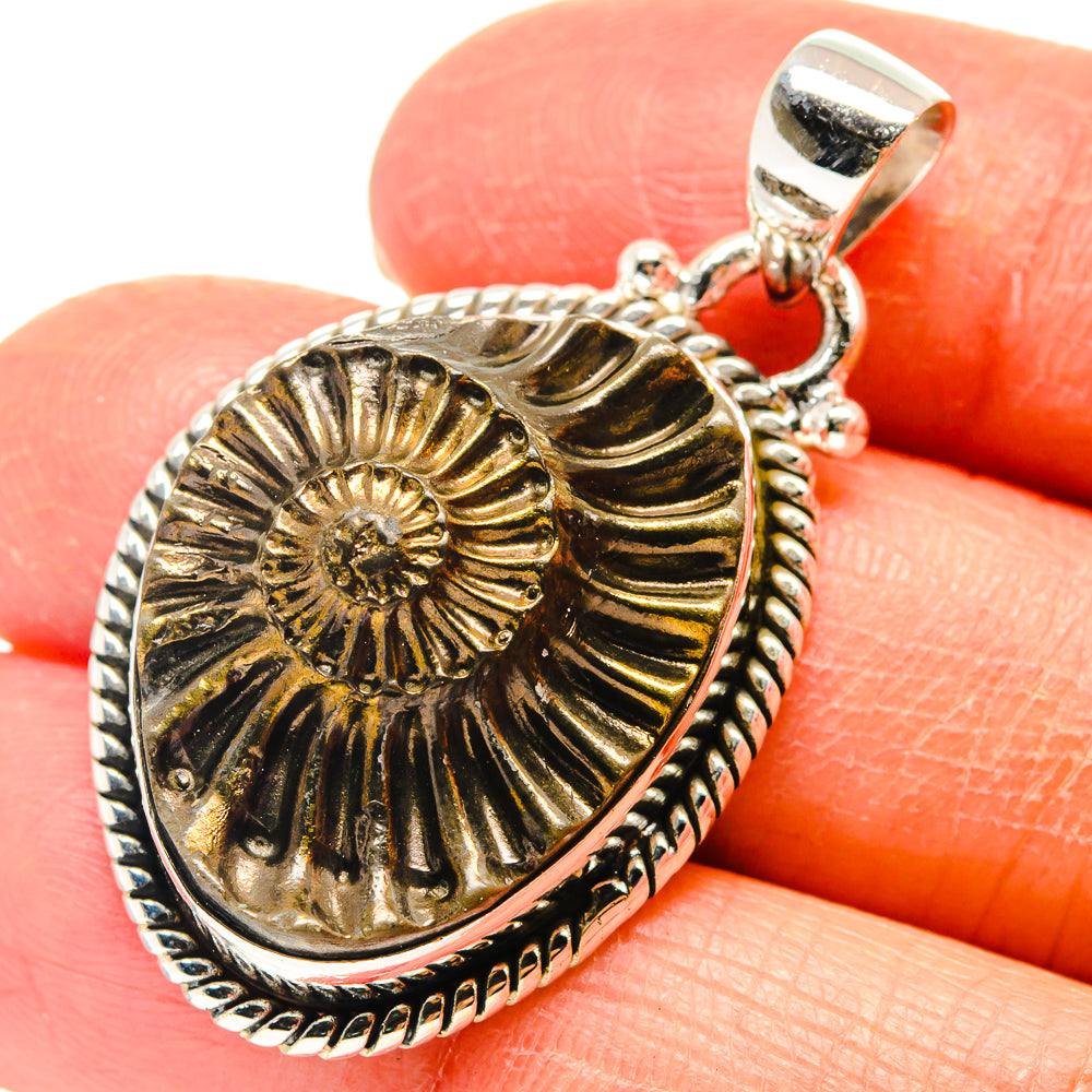 925 sterling silver pyrite fossil pendant with teardrop frame and spiral ammonite pattern
