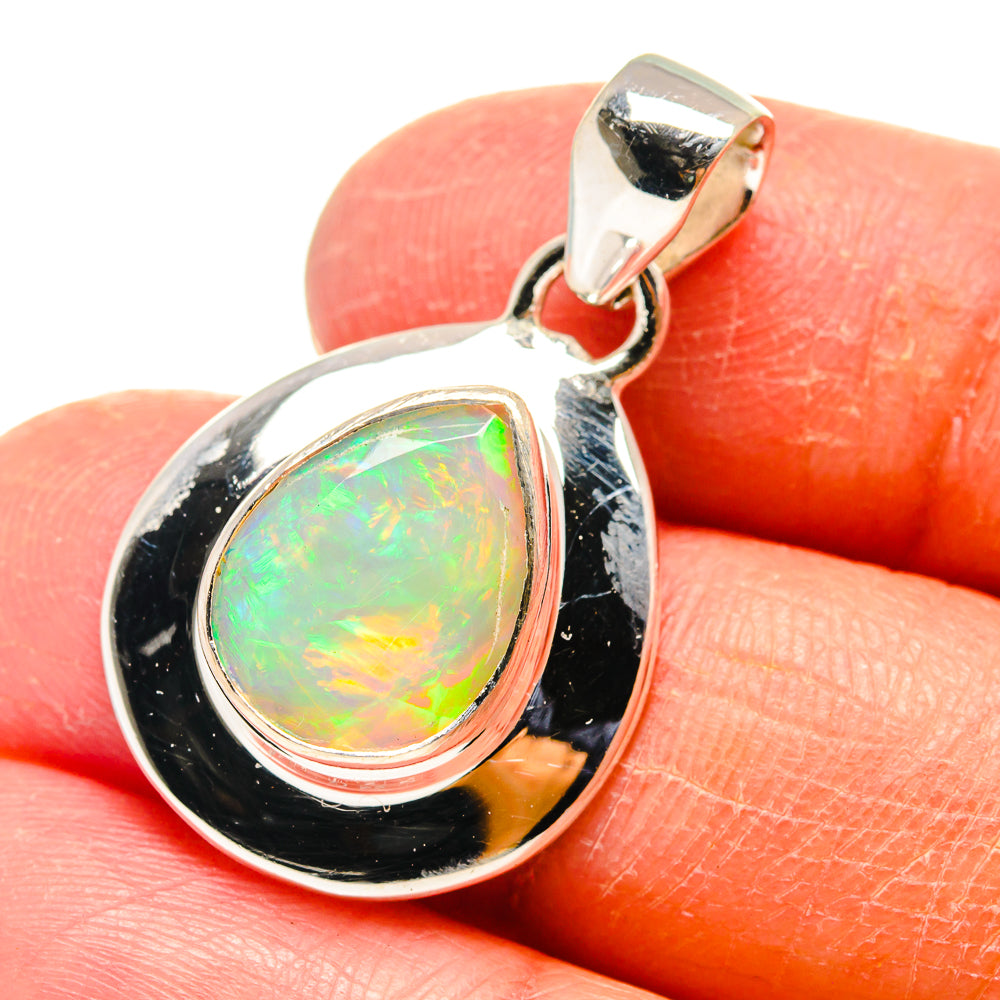 Teardrop opal pendant in 925 sterling silver with iridescent Ethiopian opal center
