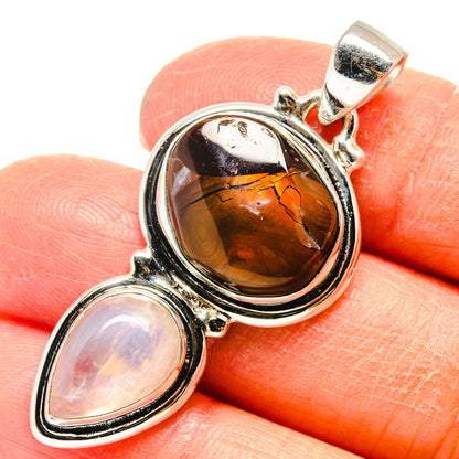 Two-stone sterling silver pendant: amber oval cabochon and pale opalescent teardrop