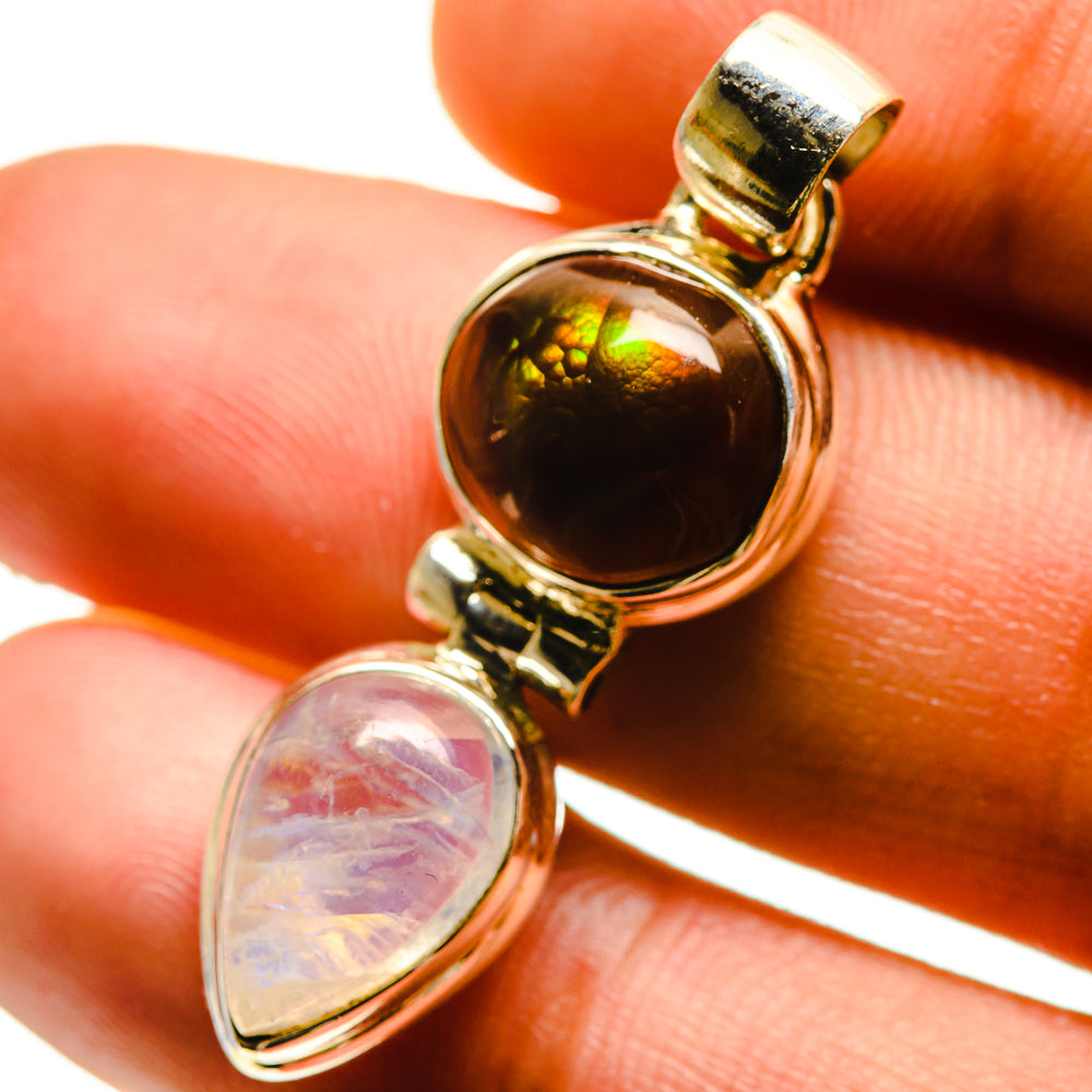 Amber-orange fire agate and opalescent moonstone teardrop pendant, gold-tone bezel bail