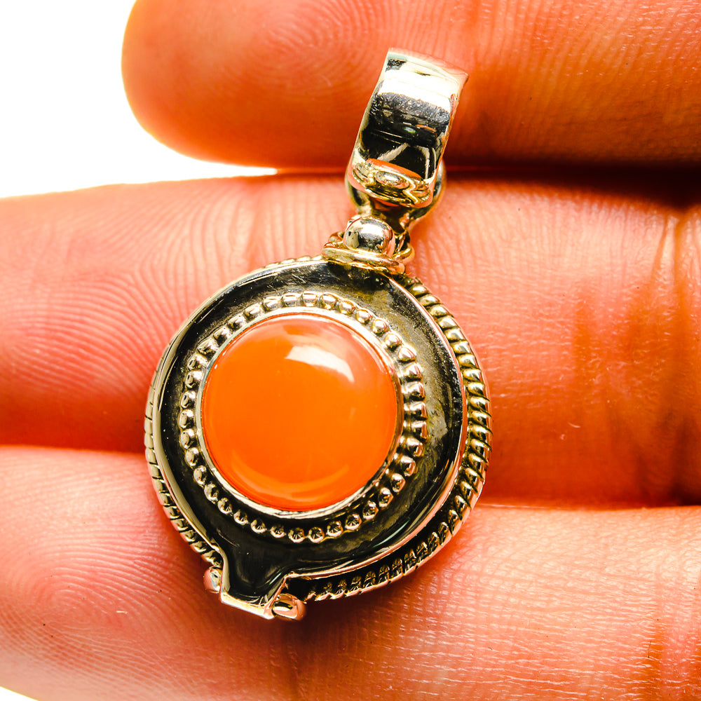 Poison pendant with orange carnelian cabochon in ornate 925 sterling silver bezel