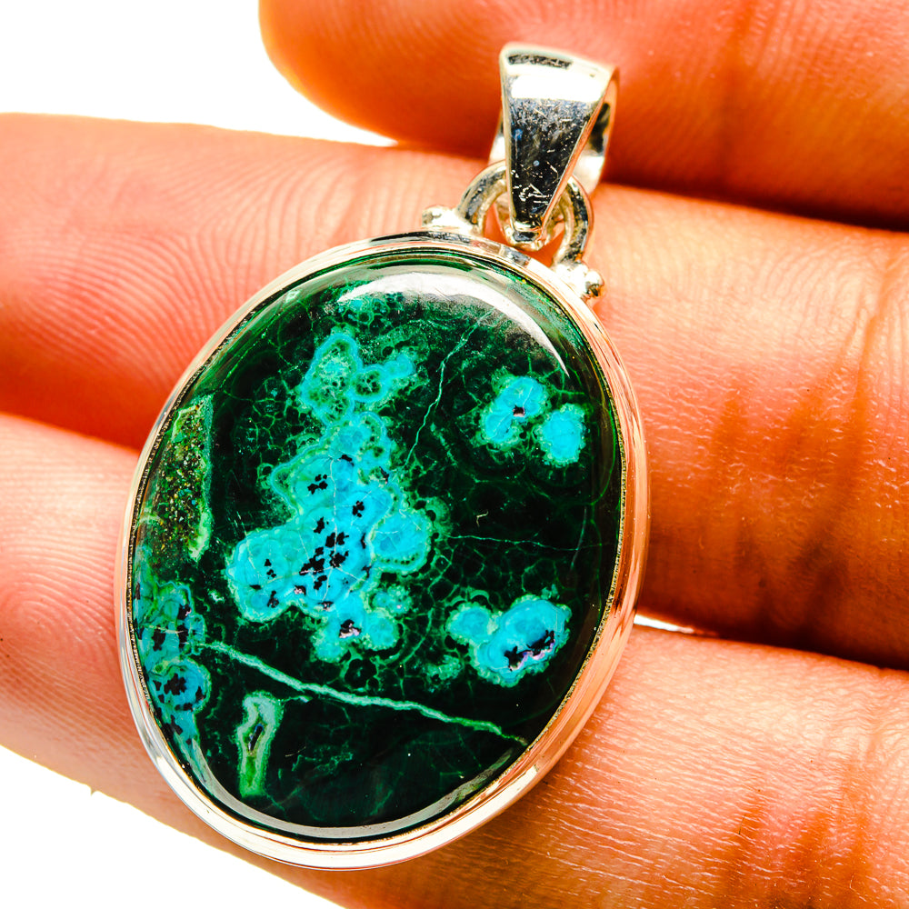 Oval green blue stone pendant with silver bail and bezel setting