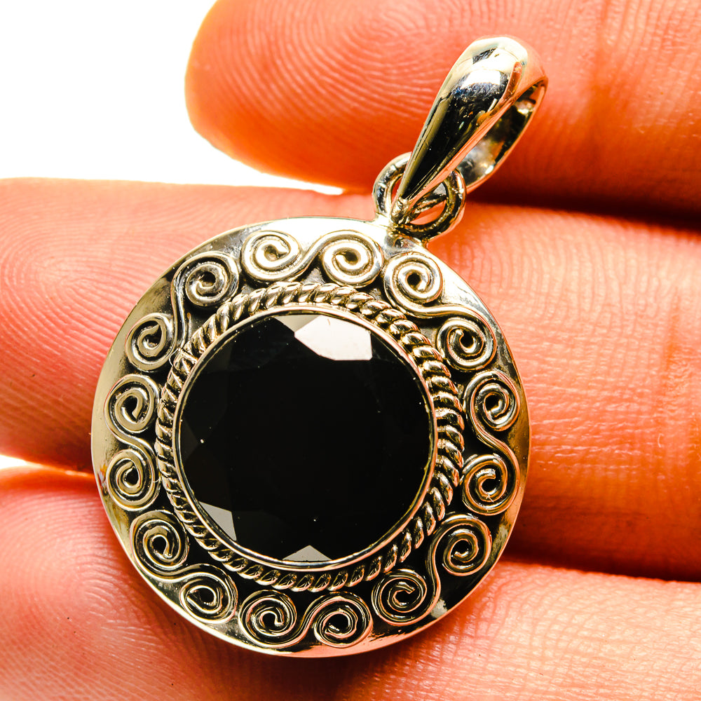 Round garnet pendant in ornate 925 sterling silver bezel, with decorative scroll frame