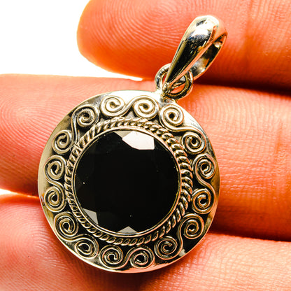 Round garnet pendant in ornate 925 sterling silver bezel, with decorative scroll frame