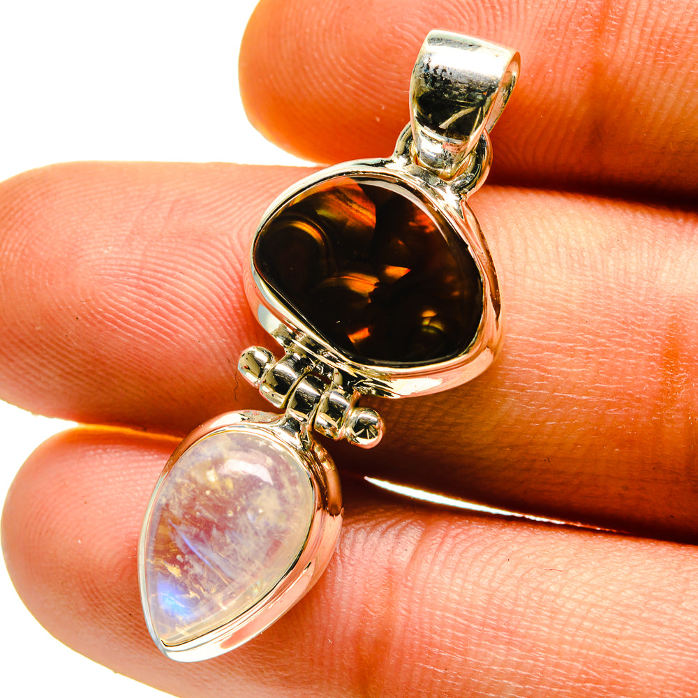Sterling silver pendant with dark amber oval cabochon and iridescent moonstone drop