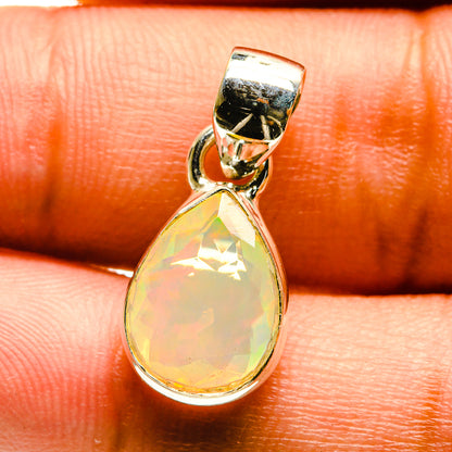 Sterling silver opal pendant with faceted pear-shaped yellow gemstone close-up