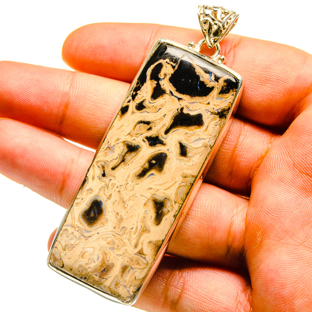 Jasper wood pendant with black-and-gold veined stone in silver bezel and bail