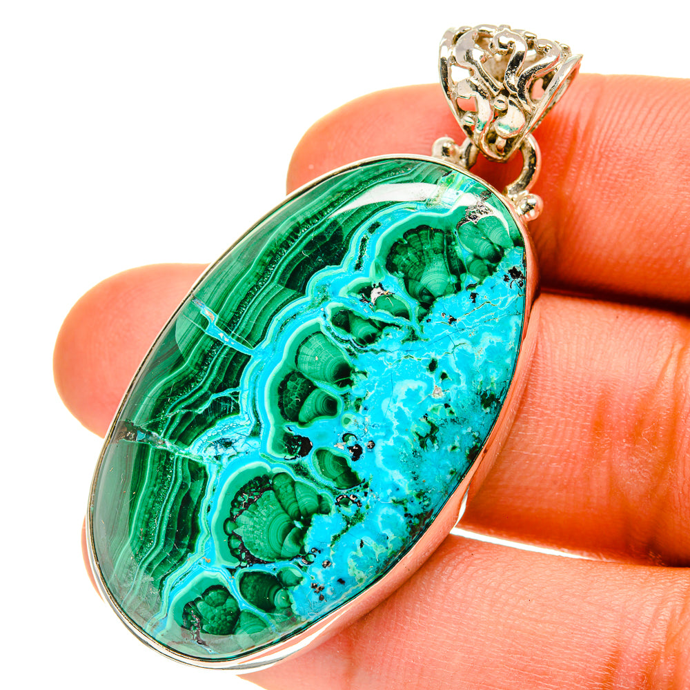 Oval malachite-chrysocolla pendant in silver with ornate bail, green and turquoise
