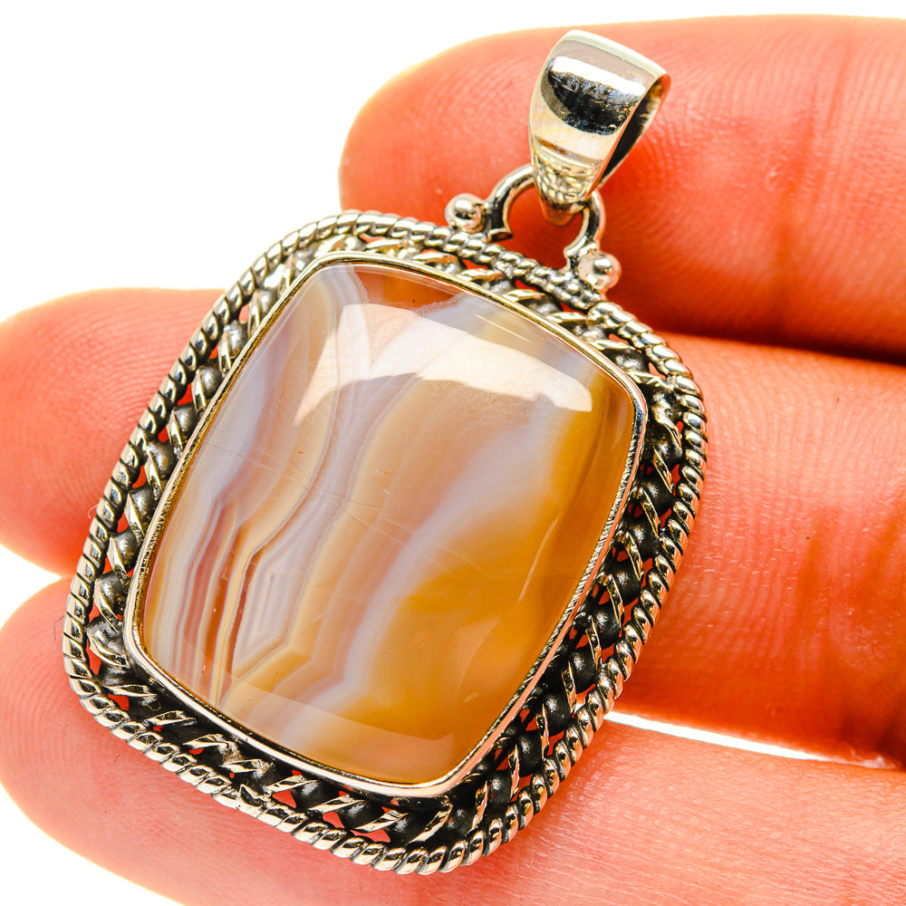 Sterling silver agate pendant with rectangular orange-and-cream Botswana agate, framed in rope