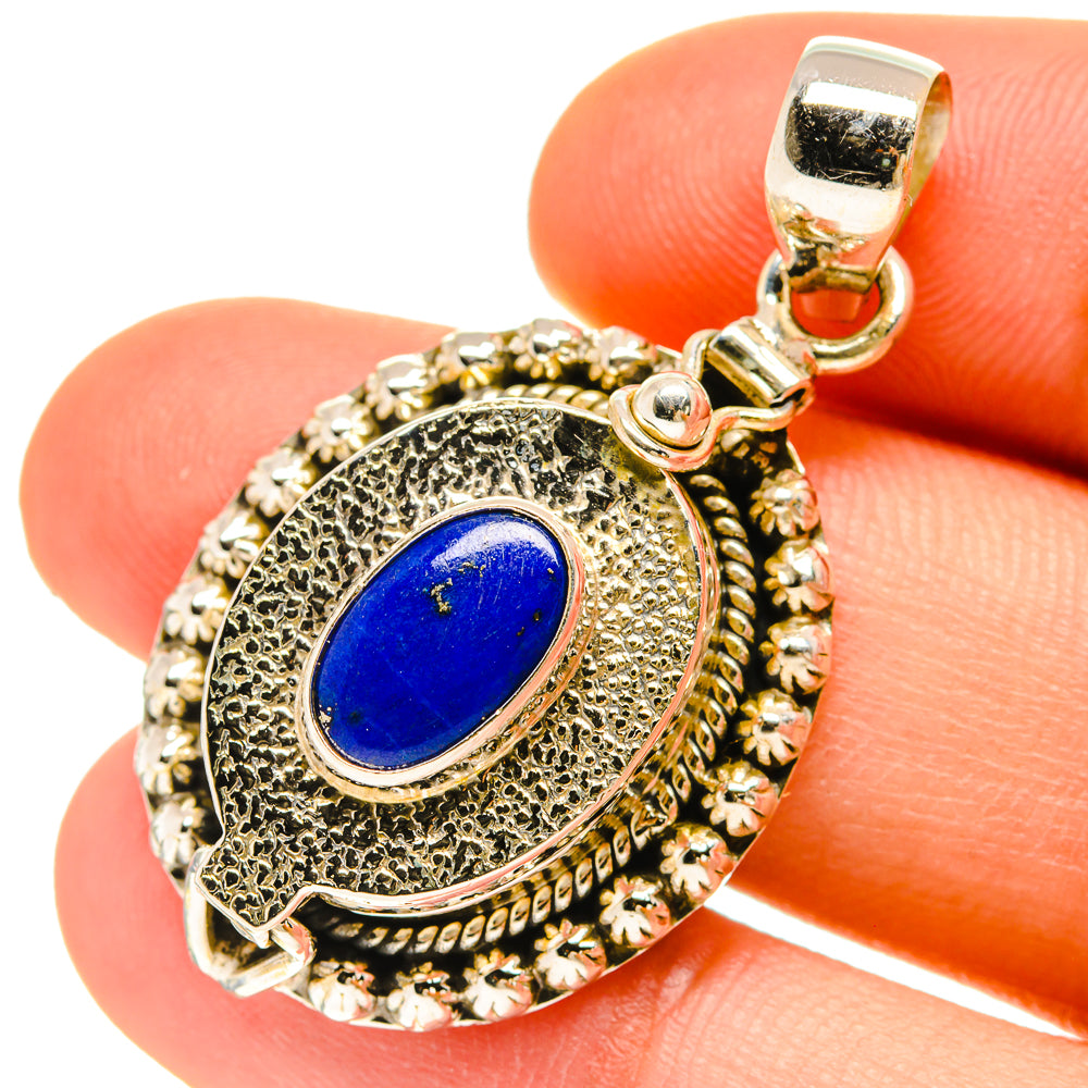 Lapis lazuli poison pendant in 925 sterling silver with oval blue stone, ornate bezel.