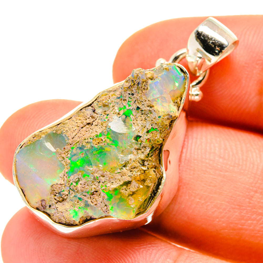 Rough Ethiopian opal pendant in 925 sterling silver with teardrop rough stone and bail