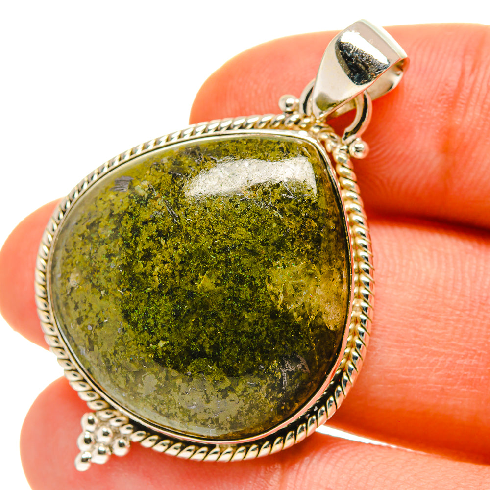 Oval Rainforest jasper pendant with textured 925 sterling silver frame and bail