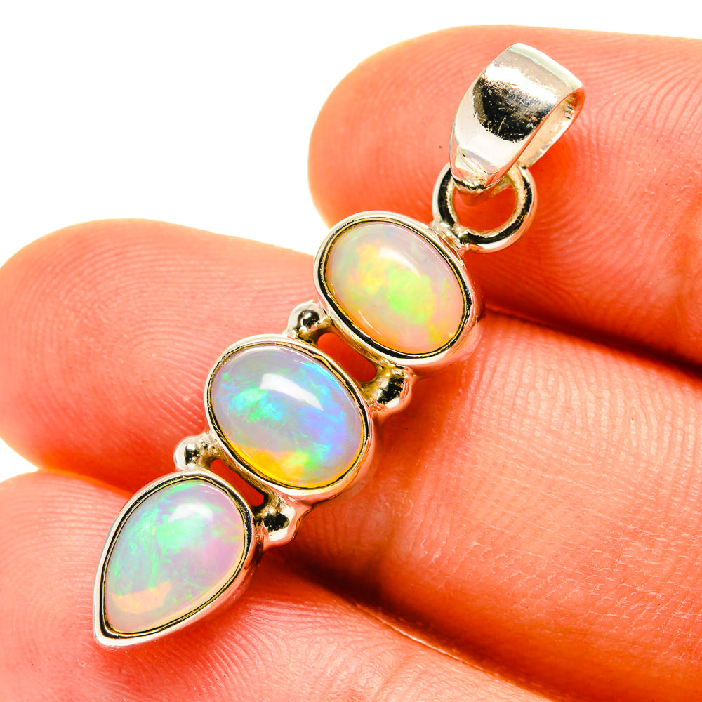 Sterling silver opal pendant with three oval cabochons and bail, iridescent white
