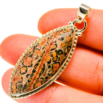 Oval Poppy Jasper pendant in 925 sterling silver with orange, black, and gold pattern