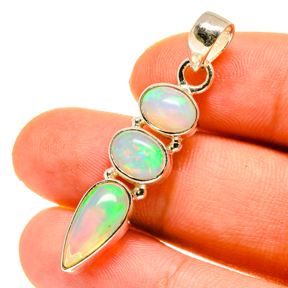 Sterling silver opal pendant with three oval and teardrop Ethiopian opals, iridescent glow