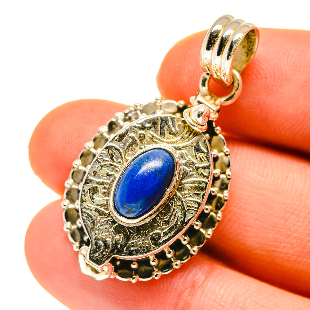Lapis lazuli poison pendant close-up with ornate bezel and oval blue cabochon