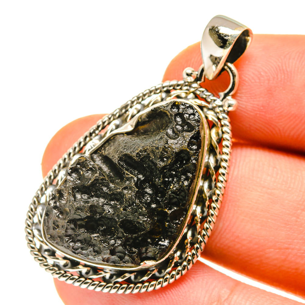 Tektite pendant in 925 sterling silver, teardrop black stone with rope bezel and bail