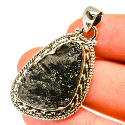 Tektite pendant in 925 sterling silver, teardrop black stone with rope bezel and bail