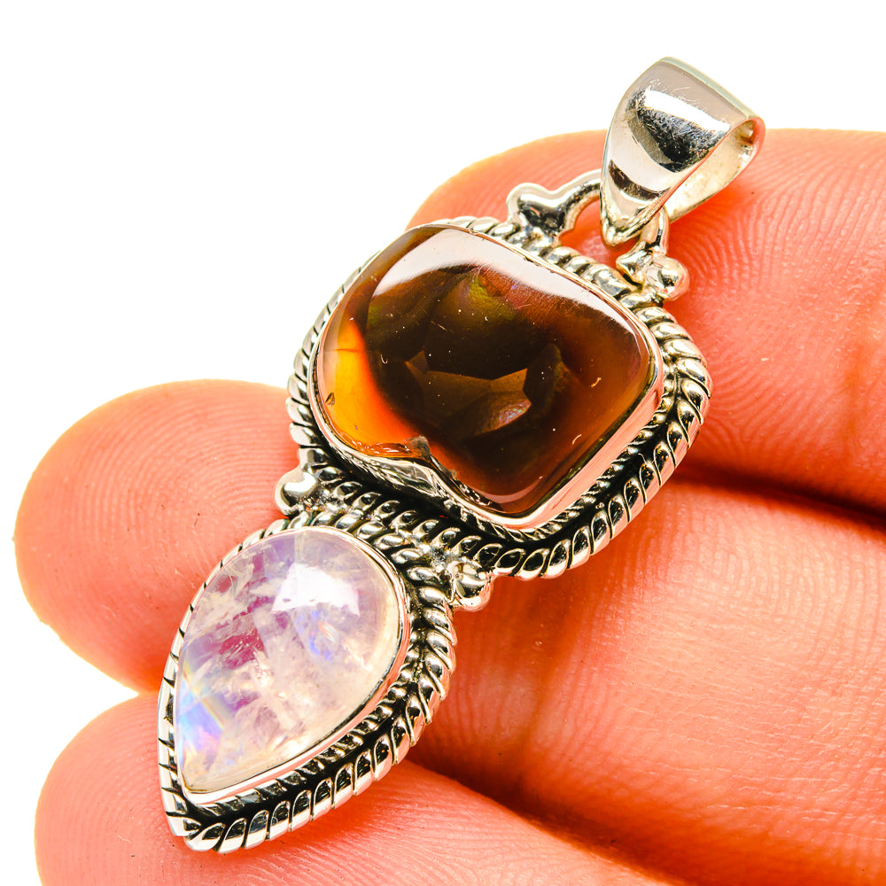 Sterling silver pendant with orange fire agate and pale pink moonstone, bail on top