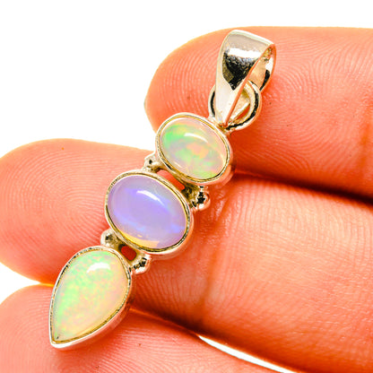 Sterling silver opal pendant with three oval iridescent stones and one pear stone