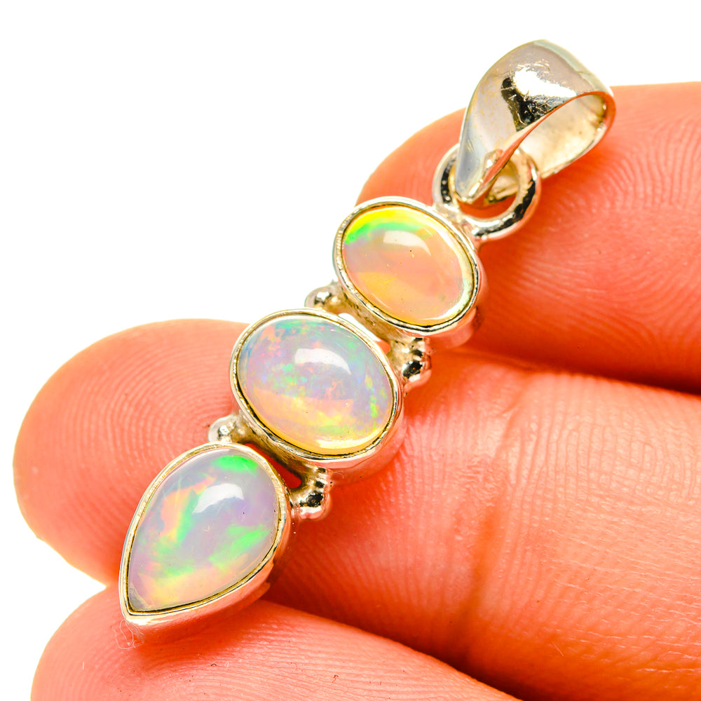 Ethiopian opal pendant close-up with three iridescent oval opal stones, 925 sterling silver