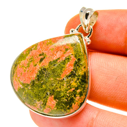 Teardrop mottled stone pendant in green and orange with sterling silver bail