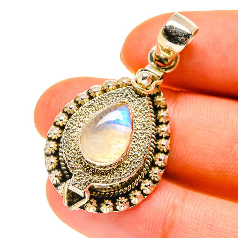 Moonstone poison pendant close-up with ornate bezel, teardrop opalescent stone, bail