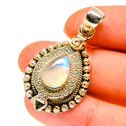 Moonstone poison pendant close-up with ornate bezel, teardrop opalescent stone, bail