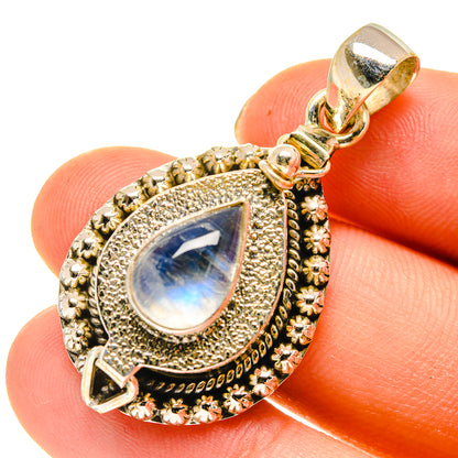 Gold-tone moonstone teardrop pendant with blue shimmer stone, ornate border and bail