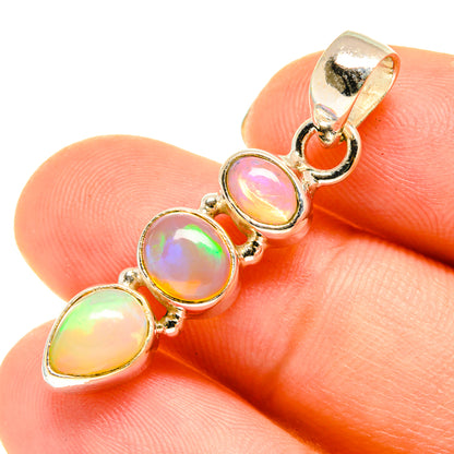Sterling silver opal pendant with three iridescent teardrop cabochons